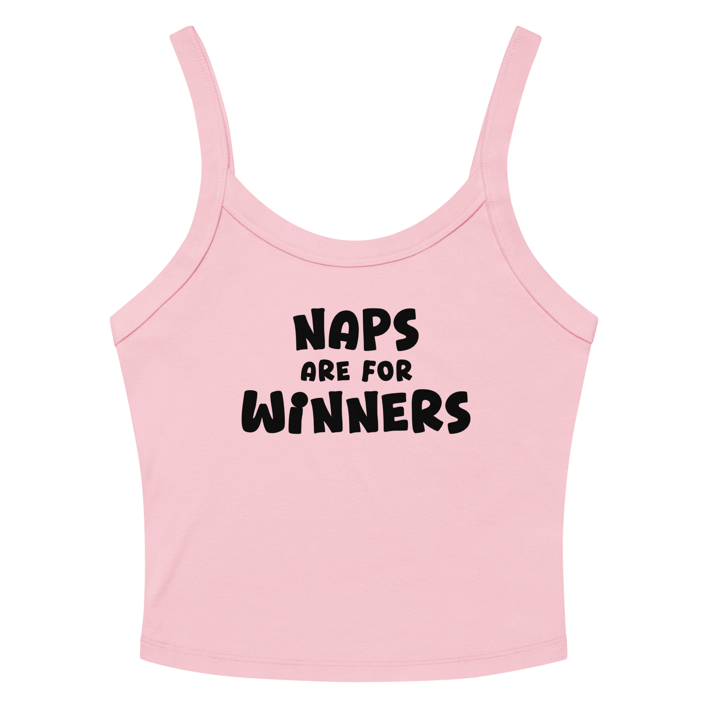 "Naps Are For Winners" printed on a solid pink blend women's micro-rib tanktop laying on a flat surface amongst sunglasses and shorts