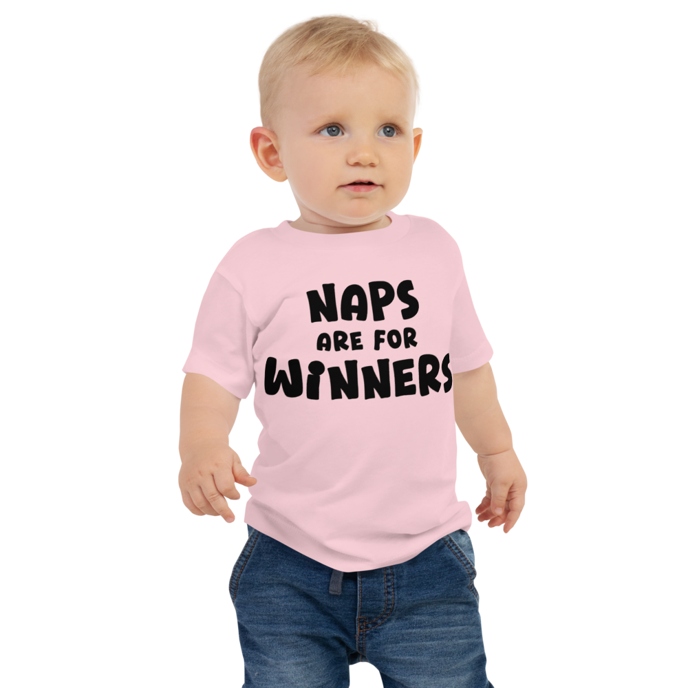 "Naps Are For Winners" printed on a pink baby jersey short sleeve tee worn by a male