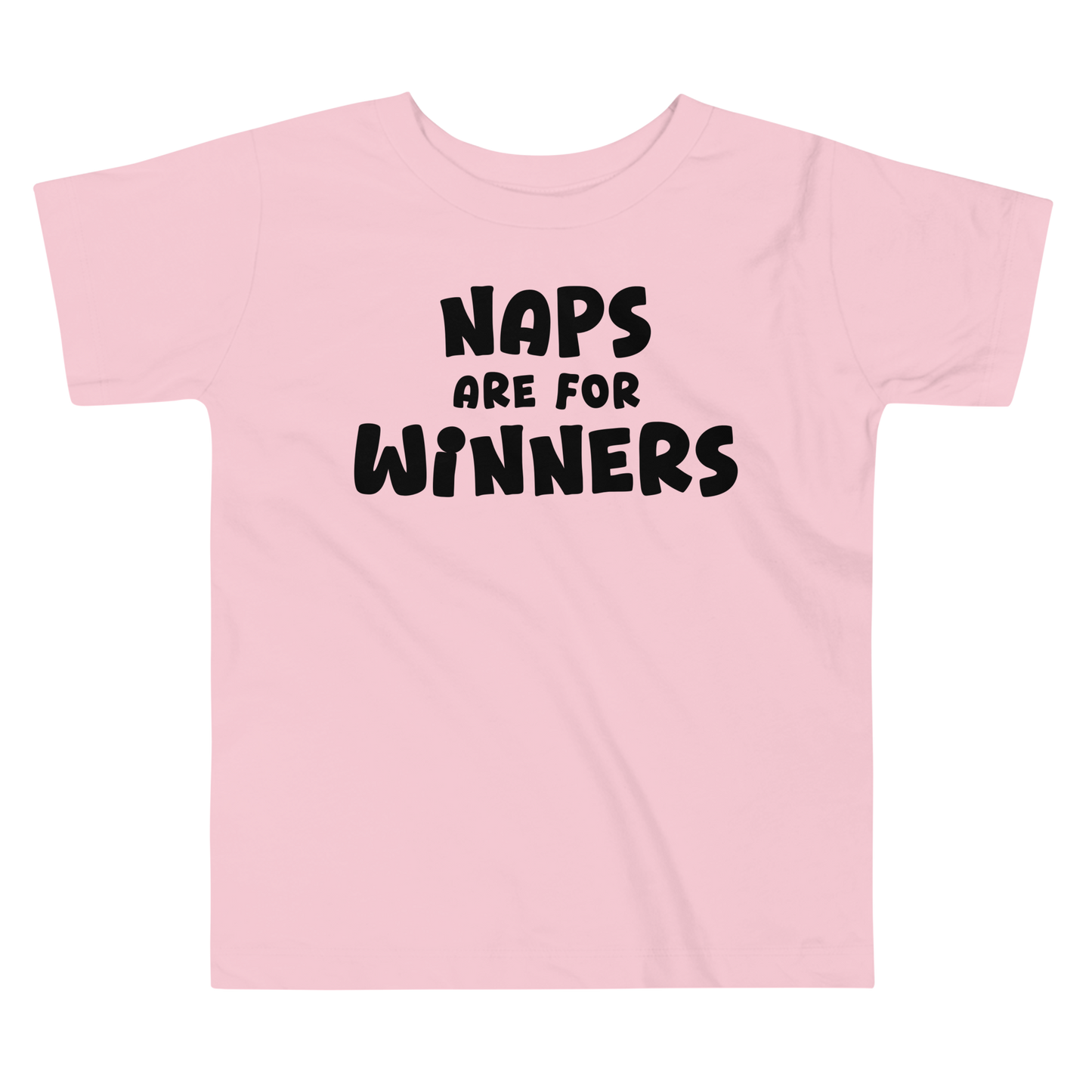 "Naps Are For Winners" printed on a pink toddler short sleeve tee laying on a flat surface