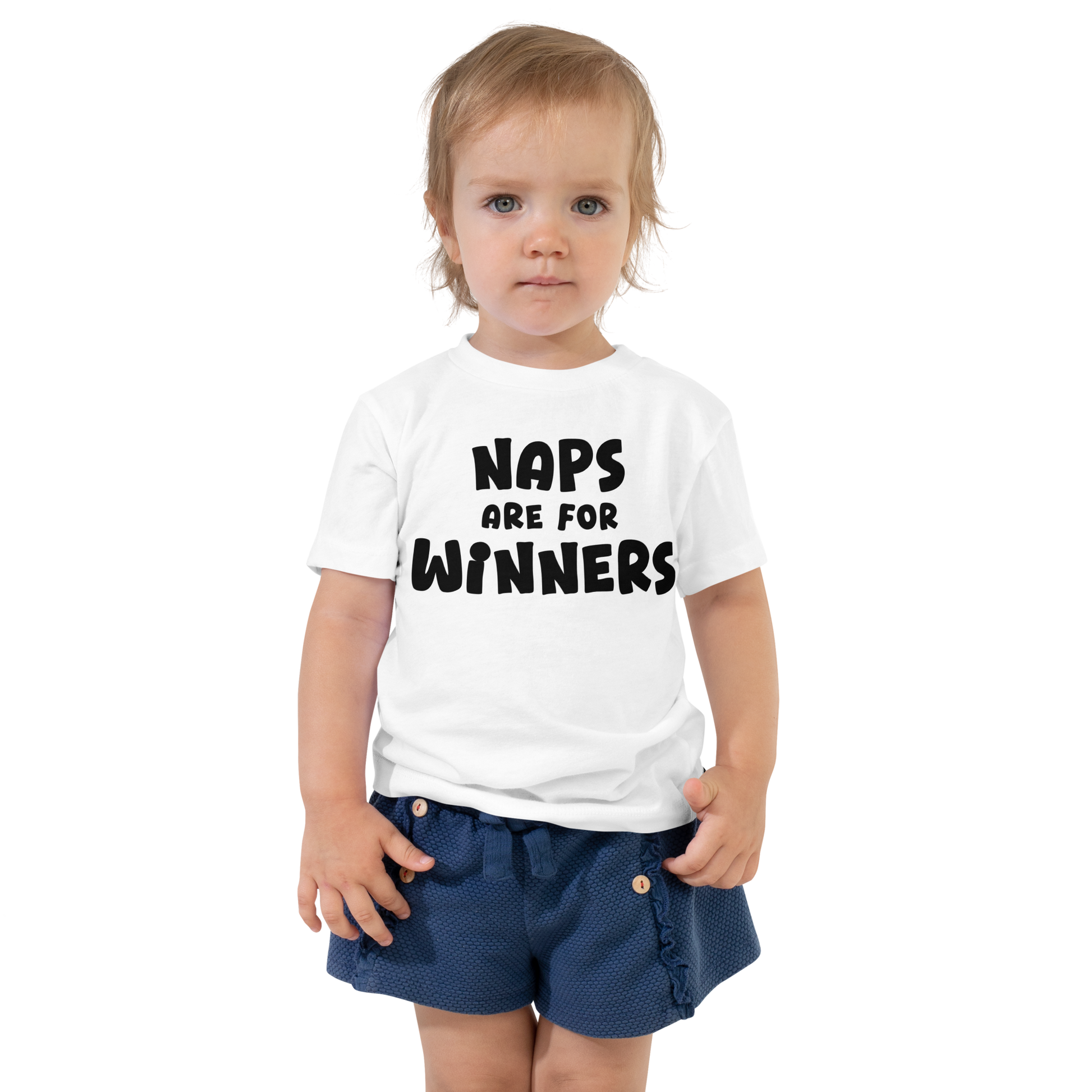 "Naps Are For Winners" printed on a white toddler short sleeve tee worn by a female