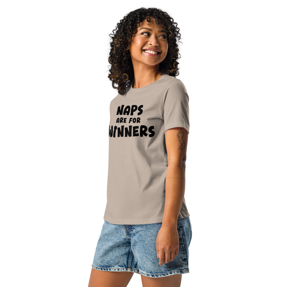 "Naps Are For Winners" printed on a heather stone women's relaxed t-shirt worn by a female
