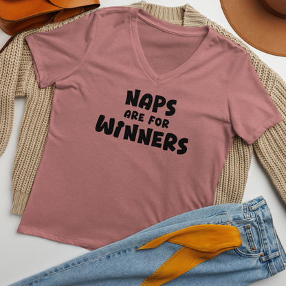 "Naps Are For Winners" printed on a heather mauve women's relaxed v-neck t-shirt laying on a flat surface amongst other clothes
