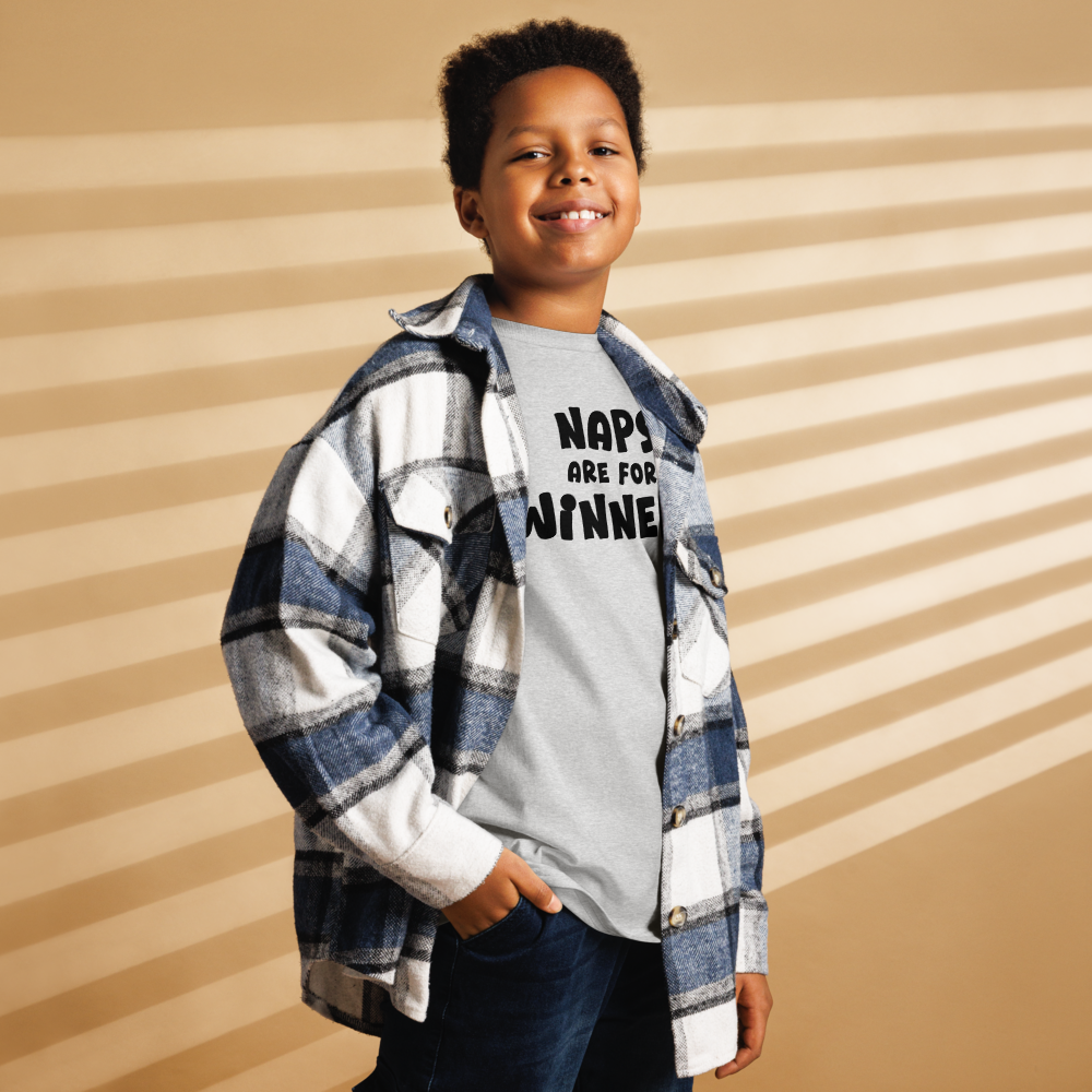 "Naps Are For Winners" printed on a sport grey youth classic tee worn by a male also wearing a jacket
