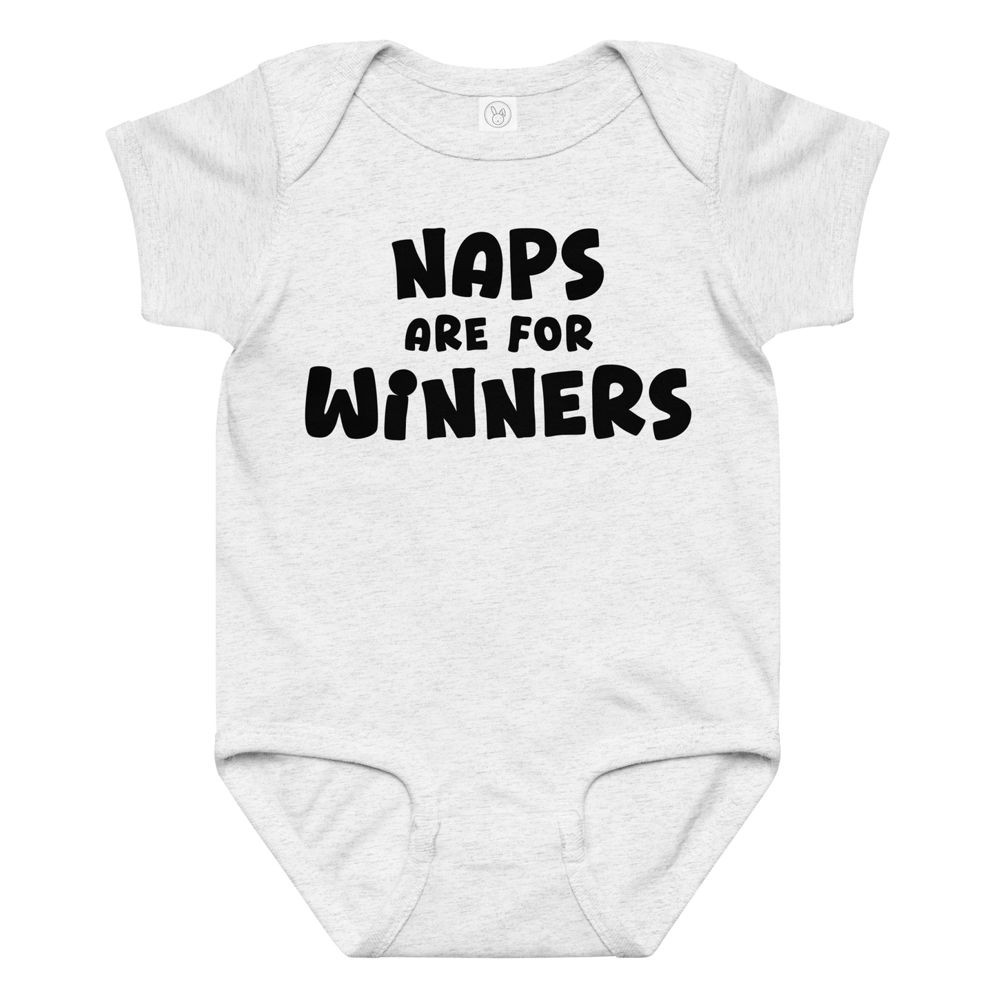 "Naps Are For Winners" printed on a ash baby jersey bodysuit laying on a flat surface amongst other clothes