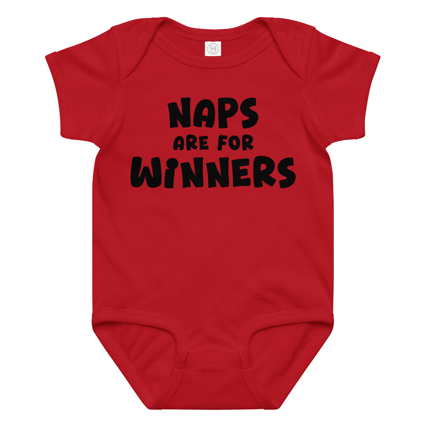 "Naps Are For Winners" printed on a red baby jersey bodysuit laying on a flat surface amongst other clothes