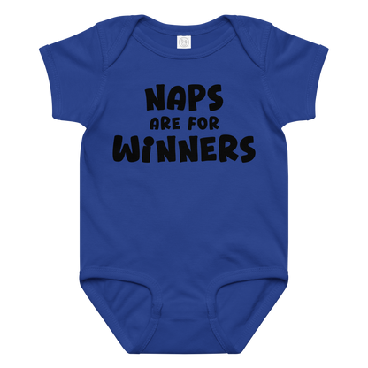 "Naps Are For Winners" printed on a royal baby jersey bodysuit laying on a flat surface amongst other clothes
