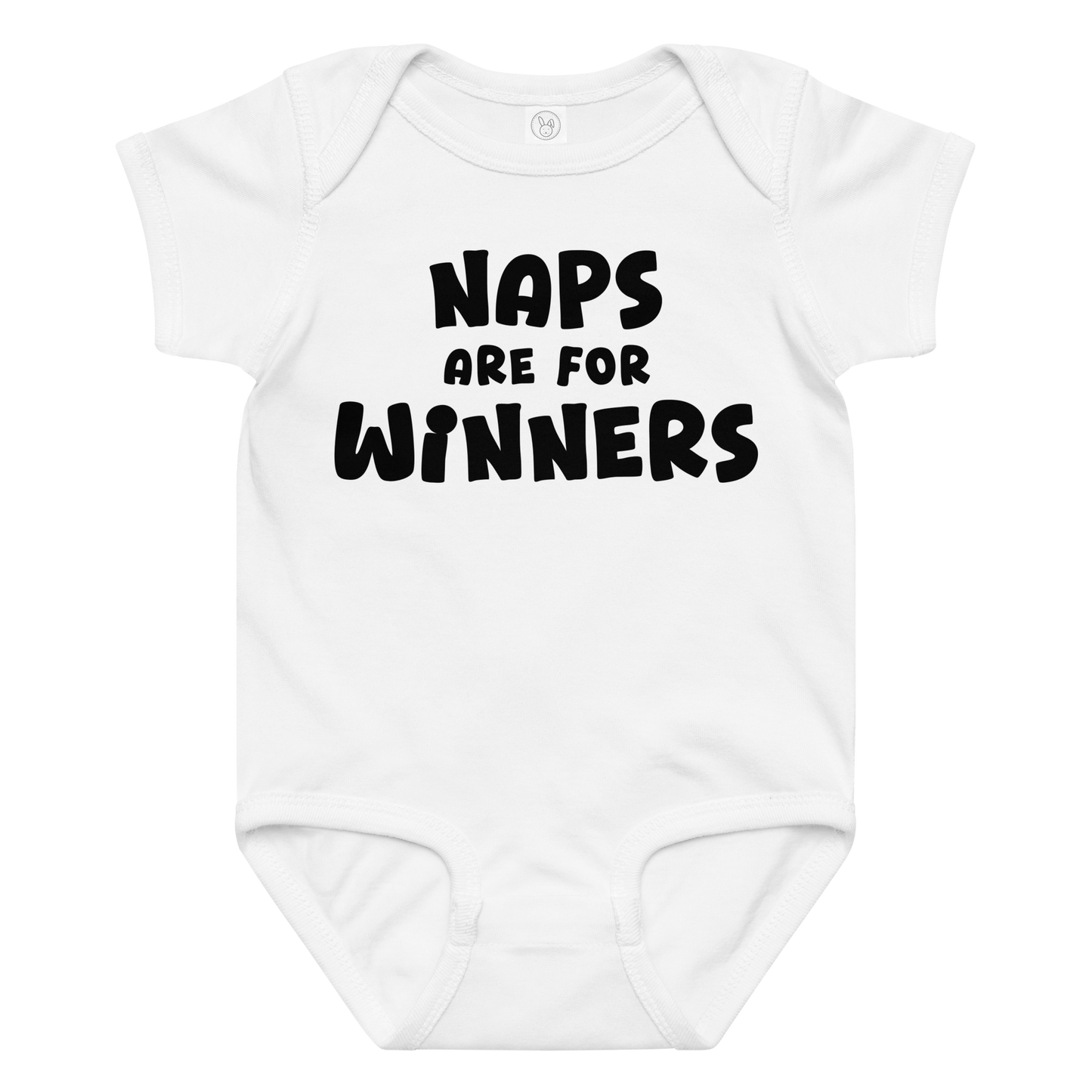 "Naps Are For Winners" printed on a white baby jersey bodysuit laying on a flat surface amongst other clothes