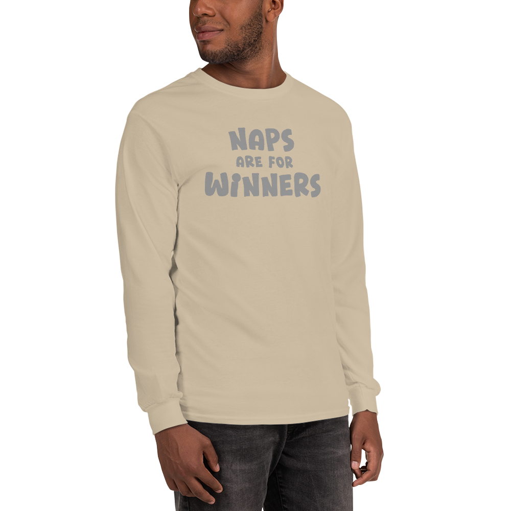 "Naps Are For Winners" printed on a sand men's long sleeve shirt worn by a male
