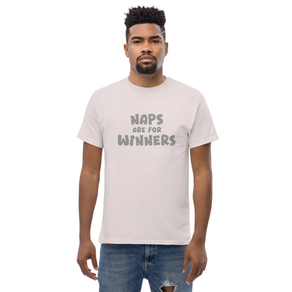 "Naps Are For Winners" printed on a ice grey unisex classic tee worn by a male