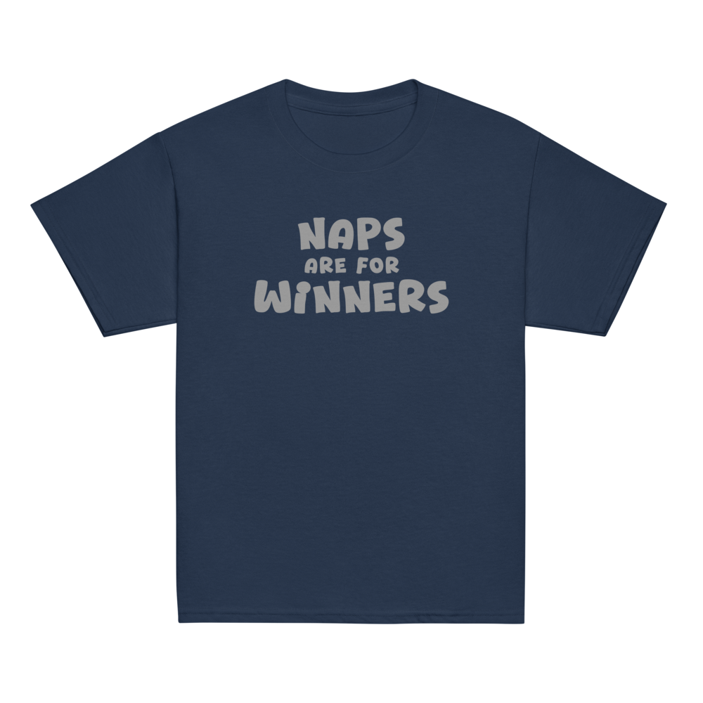 "Naps Are For Winners" printed on a navy youth classic tee laying on a flat surface