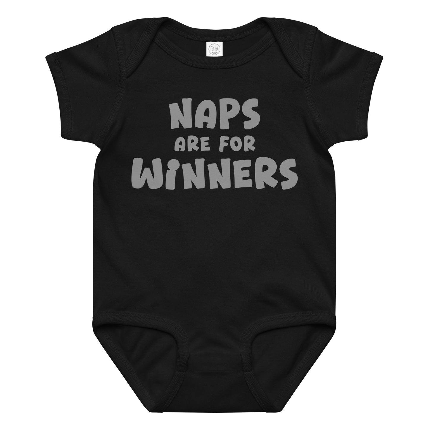 "Naps Are For Winners" printed on a black baby jersey bodysuit laying on a flat surface amongst other clothes