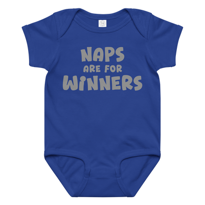 "Naps Are For Winners" printed on a royal baby jersey bodysuit laying on a flat surface amongst other clothes