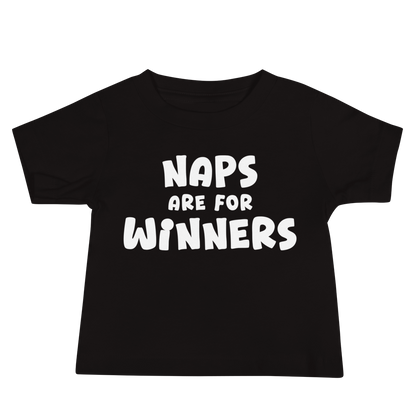 "Naps Are For Winners" printed on a black baby jersey short sleeve tee laying on a flat surface
