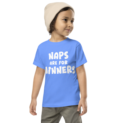 "Naps Are For Winners" printed on a heather columbia blue toddler short sleeve tee worn by a male wearing a cap