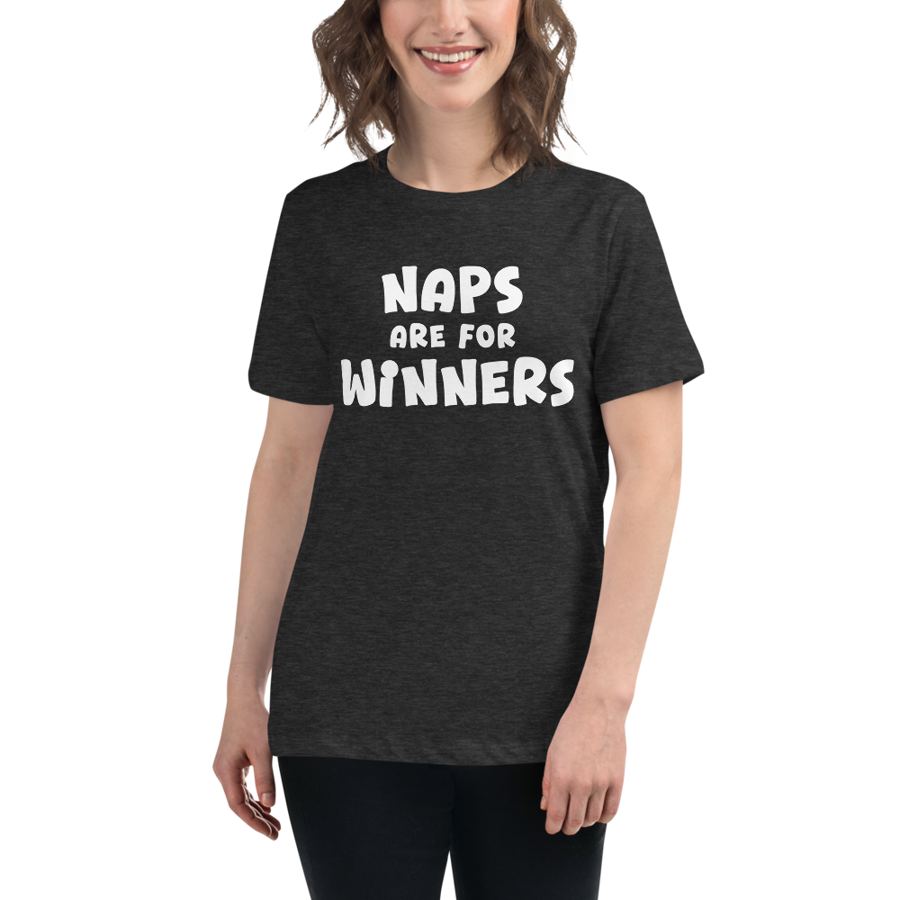 "Naps Are For Winners" printed on a dark grey heather women's relaxed t-shirt worn by a female