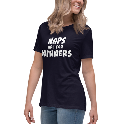 "Naps Are For Winners" printed on a navy women's relaxed t-shirt worn by a female