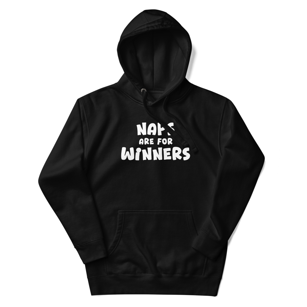 "Naps Are For Winners" printed on a black unisex hoodie laying on a flat surface with the hood up