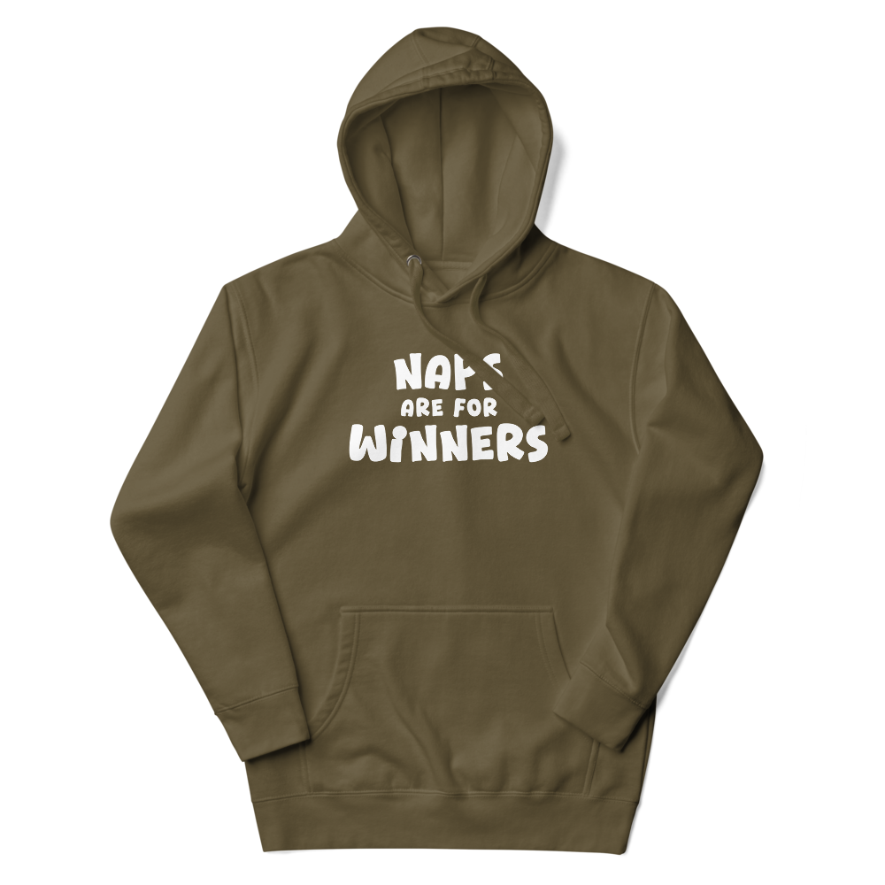 "Naps Are For Winners" printed on a military green unisex hoodie laying on a flat surface with the hood up