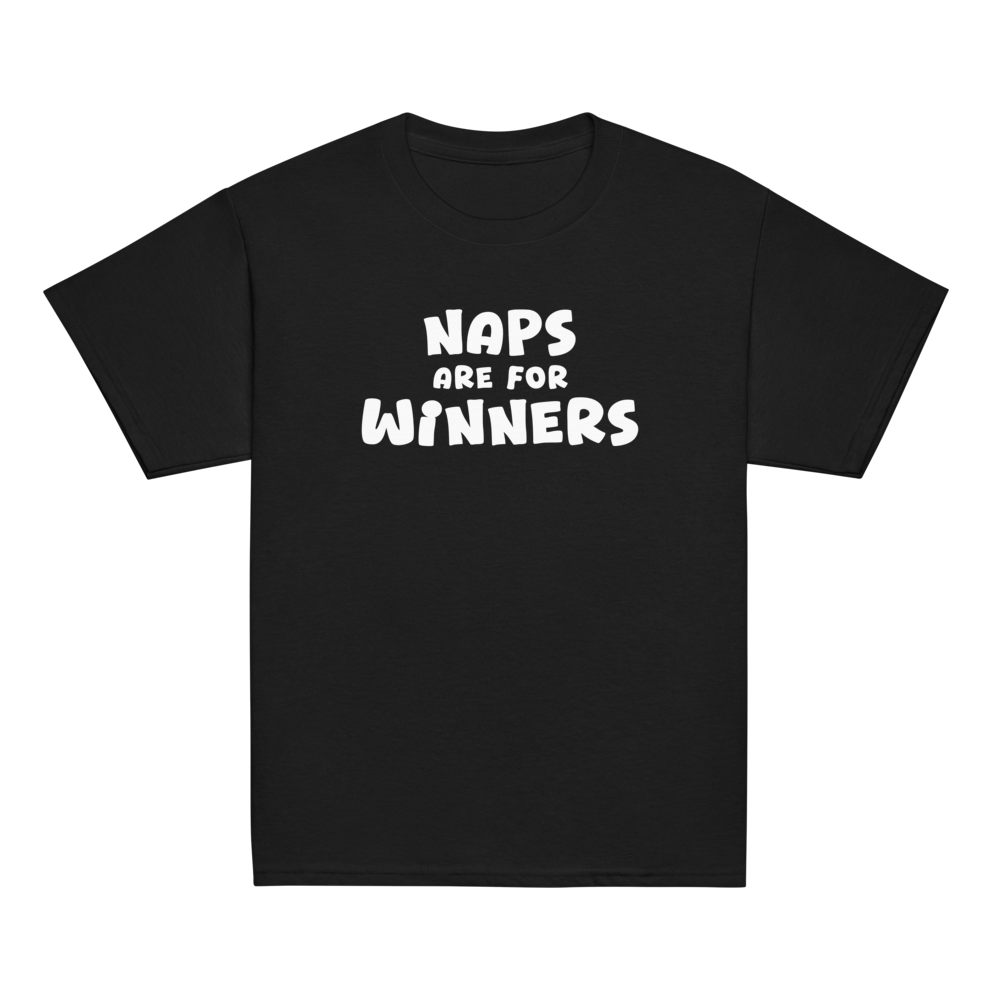 "Naps Are For Winners" printed on a black youth classic tee laying on a flat surface