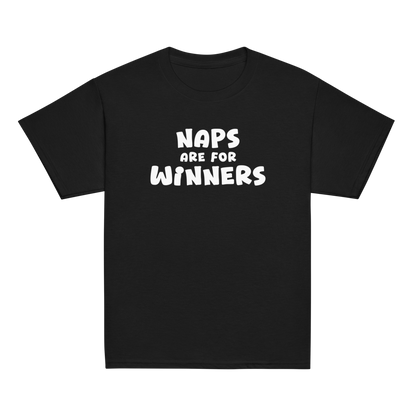 "Naps Are For Winners" printed on a black youth classic tee laying on a flat surface