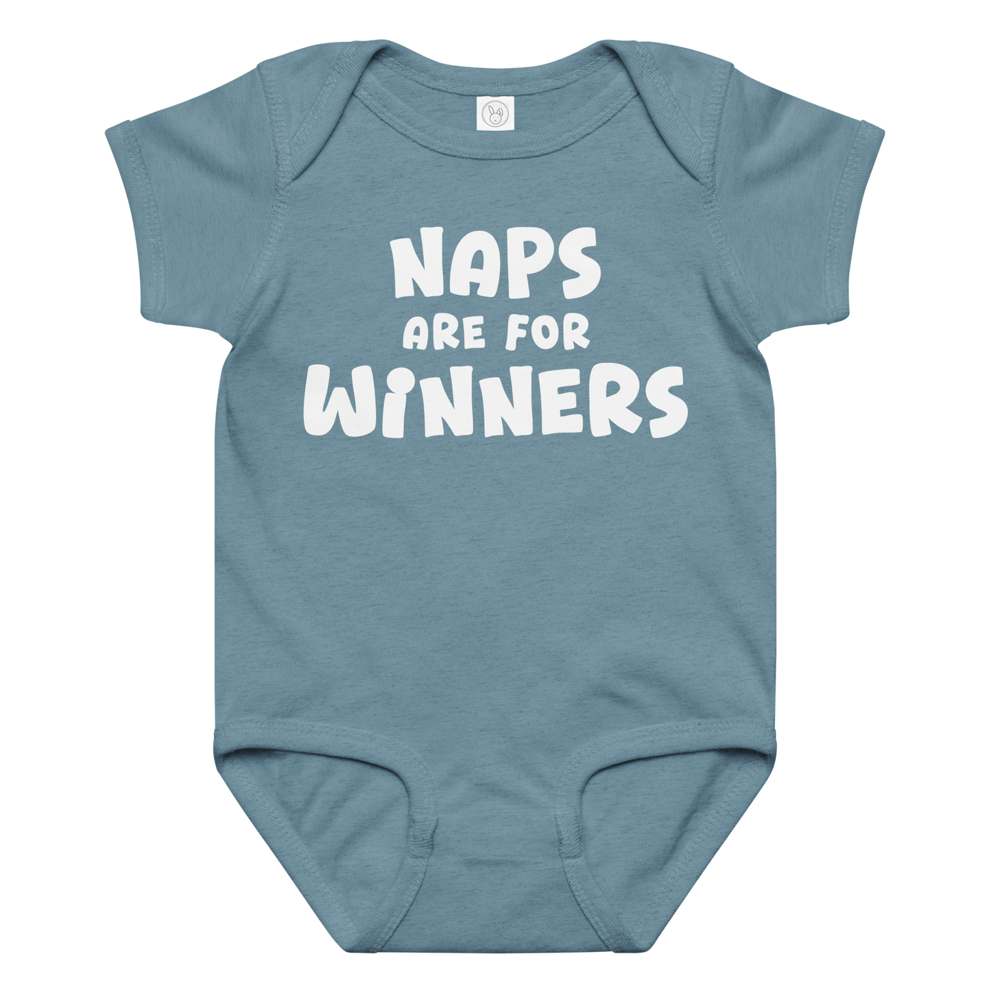 "Naps Are For Winners" printed on a vintage indigo baby jersey bodysuit laying on a flat surface amongst other clothes
