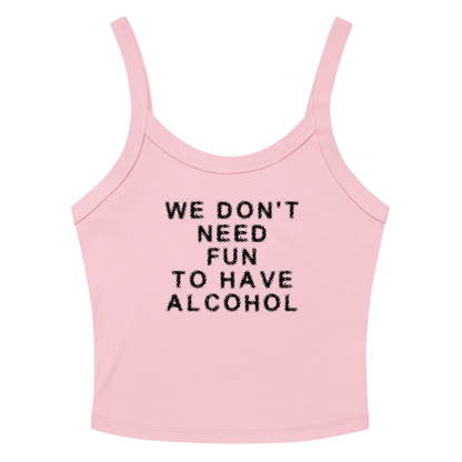 "We don’t need fun to have alcohol" printed on a solid pink blend women's micro-rib tanktop laying on a flat surface amongst sunglasses and shorts