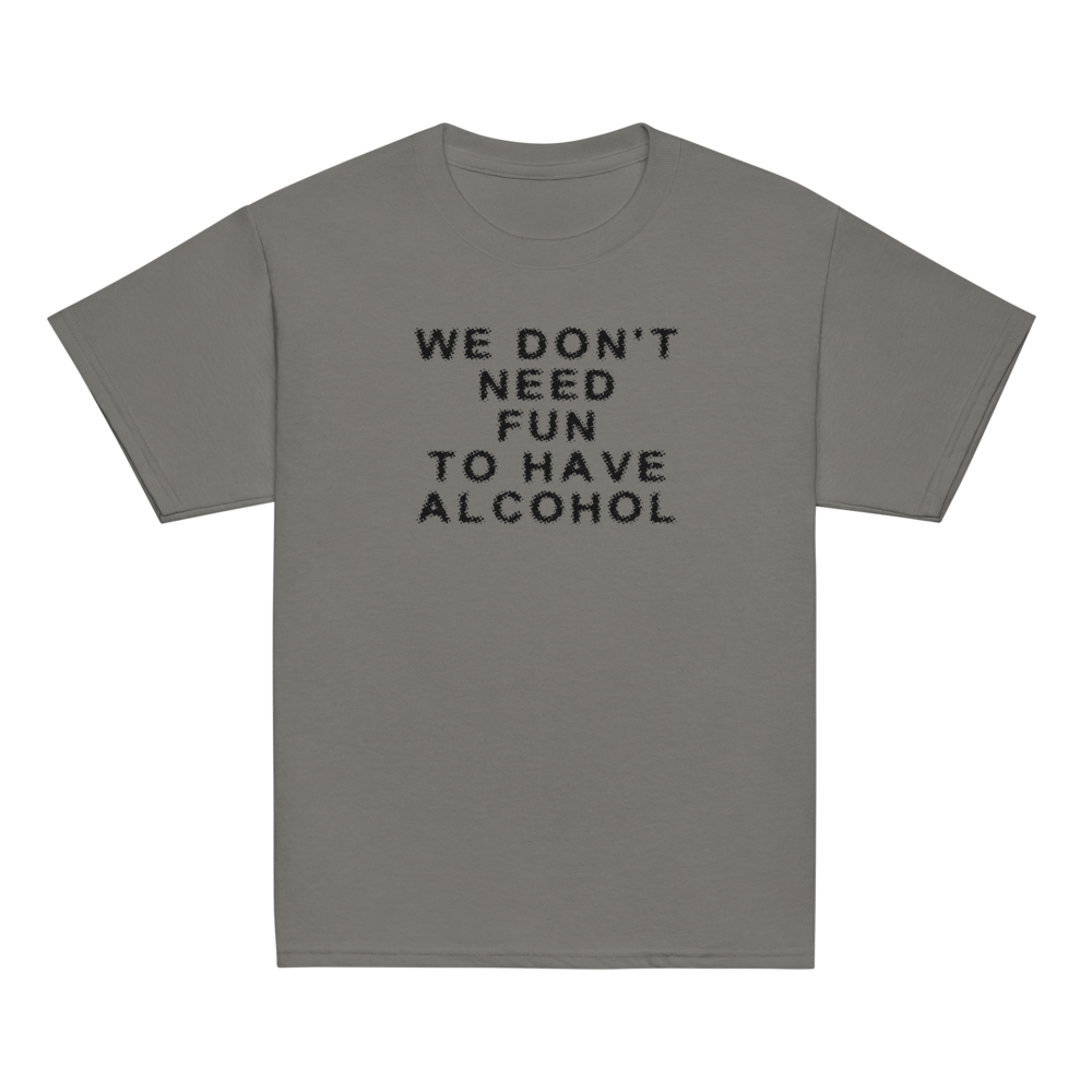 "We don’t need fun to have alcohol" printed on a charcoal youth classic tee laying on a flat surface