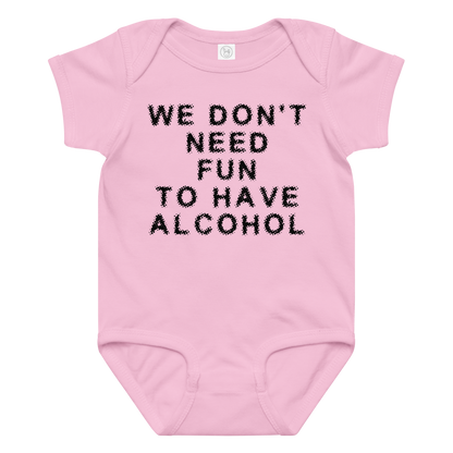 "We don’t need fun to have alcohol" printed on a pink baby jersey bodysuit laying on a flat surface amongst other clothes
