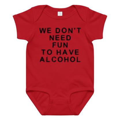 "We don’t need fun to have alcohol" printed on a red baby jersey bodysuit laying on a flat surface amongst other clothes