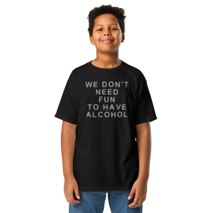 "We don’t need fun to have alcohol" printed on a black youth classic tee worn by a male