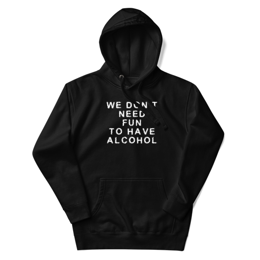 "We don’t need fun to have alcohol" printed on a black unisex hoodie laying on a flat surface with the hood up