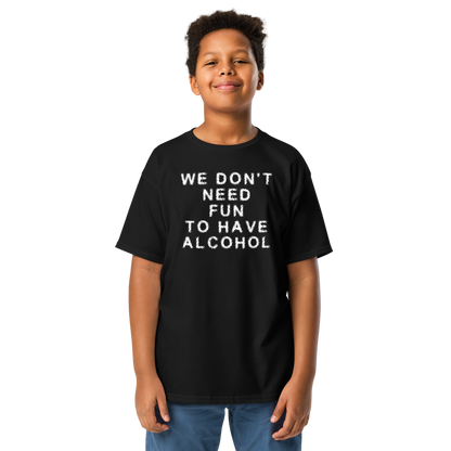 "We don’t need fun to have alcohol" printed on a black youth classic tee worn by a male