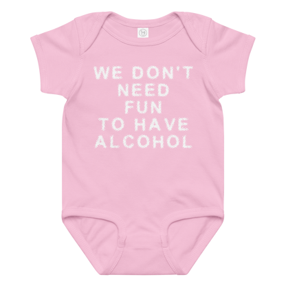 "We don’t need fun to have alcohol" printed on a pink baby jersey bodysuit laying on a flat surface amongst other clothes