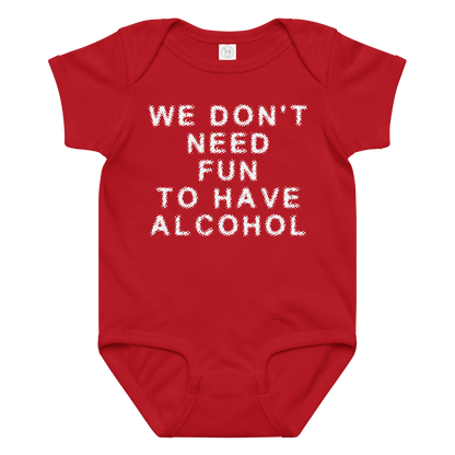 "We don’t need fun to have alcohol" printed on a red baby jersey bodysuit laying on a flat surface amongst other clothes
