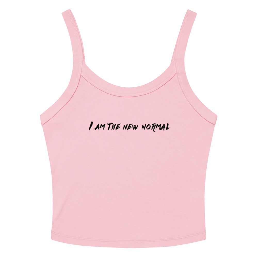 "I am the new normal" printed on a solid pink blend women's micro-rib tanktop laying on a flat surface amongst sunglasses and shorts
