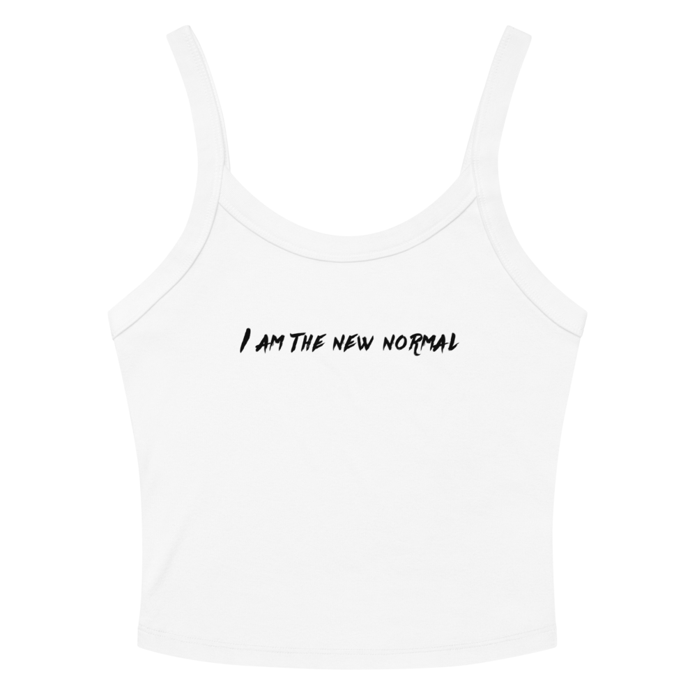 "I am the new normal" printed on a solid white blend women's micro-rib tanktop laying on a flat surface amongst sunglasses and shorts