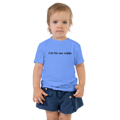 "I am the new normal" printed on a heather columbia blue toddler short sleeve tee worn by a female