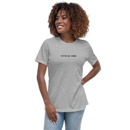 "I am the new normal" printed on a athletic heather women's relaxed t-shirt worn by a female