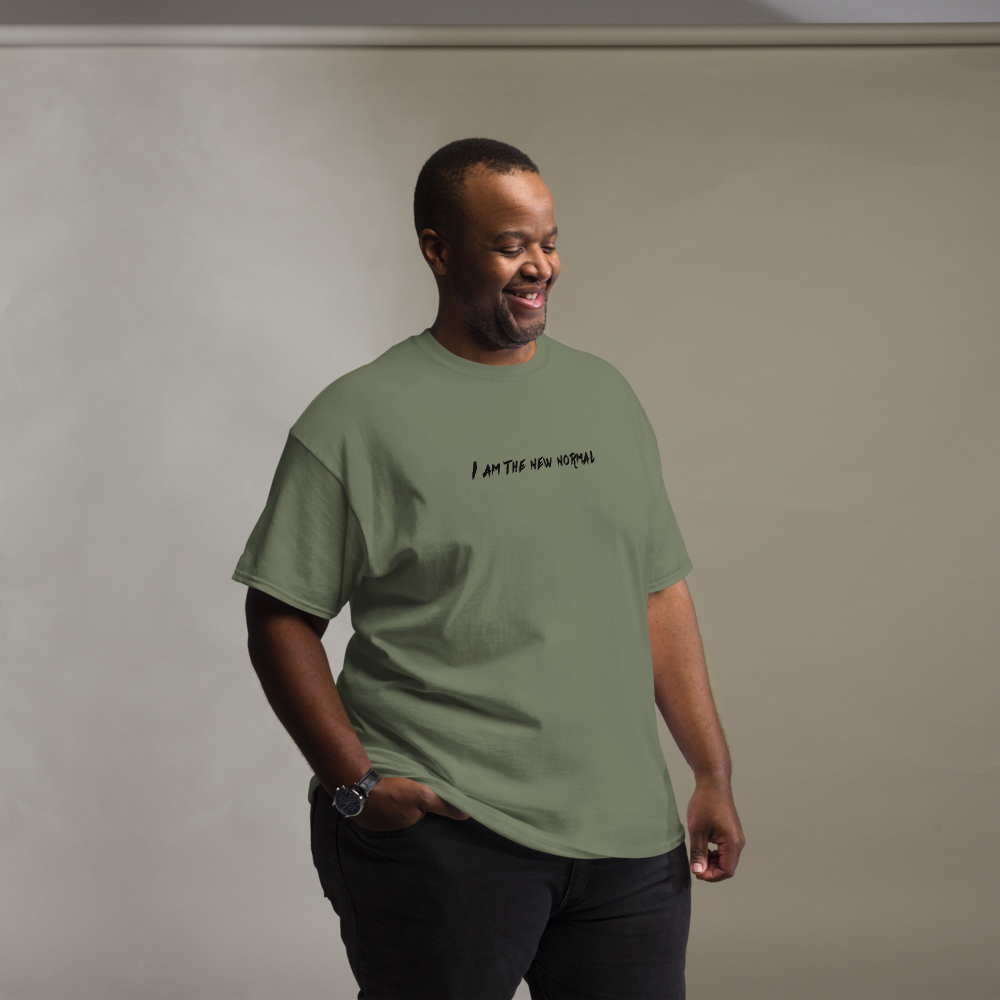 "I am the new normal" printed on a military green unisex classic tee worn by a male