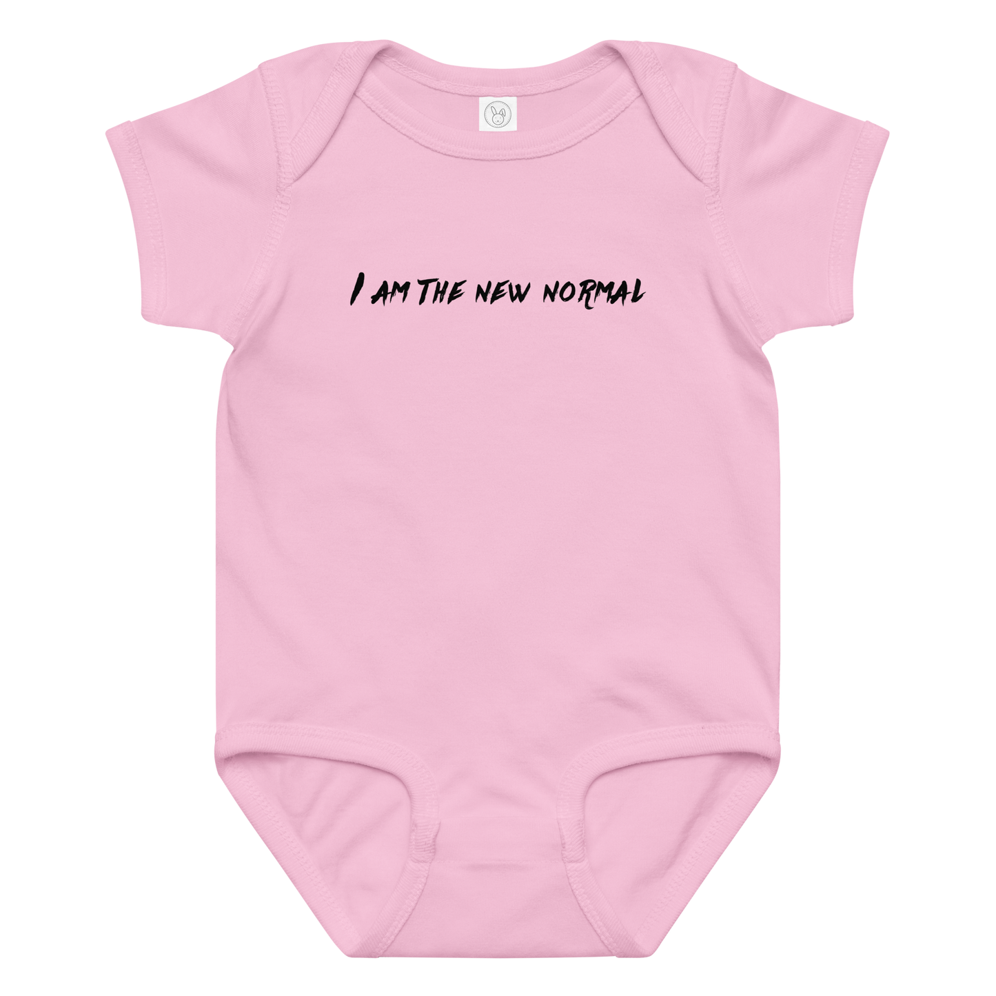 "I am the new normal" printed on a pink baby jersey bodysuit laying on a flat surface amongst other clothes