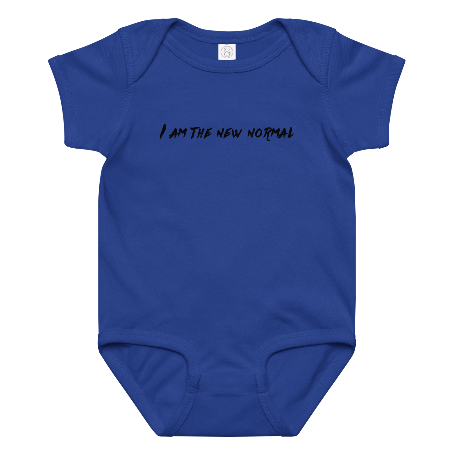 "I am the new normal" printed on a royal baby jersey bodysuit laying on a flat surface amongst other clothes