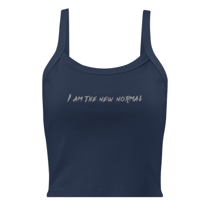"I am the new normal" printed on a solid navy blend women's micro-rib tanktop laying on a flat surface