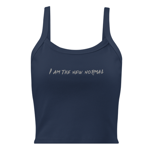 "I am the new normal" printed on a solid navy blend women's micro-rib tanktop laying on a flat surface