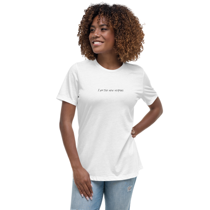 "I am the new normal" printed on a white women's relaxed t-shirt worn by a female