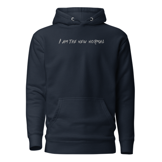 "I am the new normal" printed on a navy blazer on an invisible / simulated body