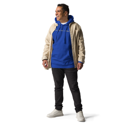 "I am the new normal" printed on a team royal unisex hoodie worn by a male with a jacket on top