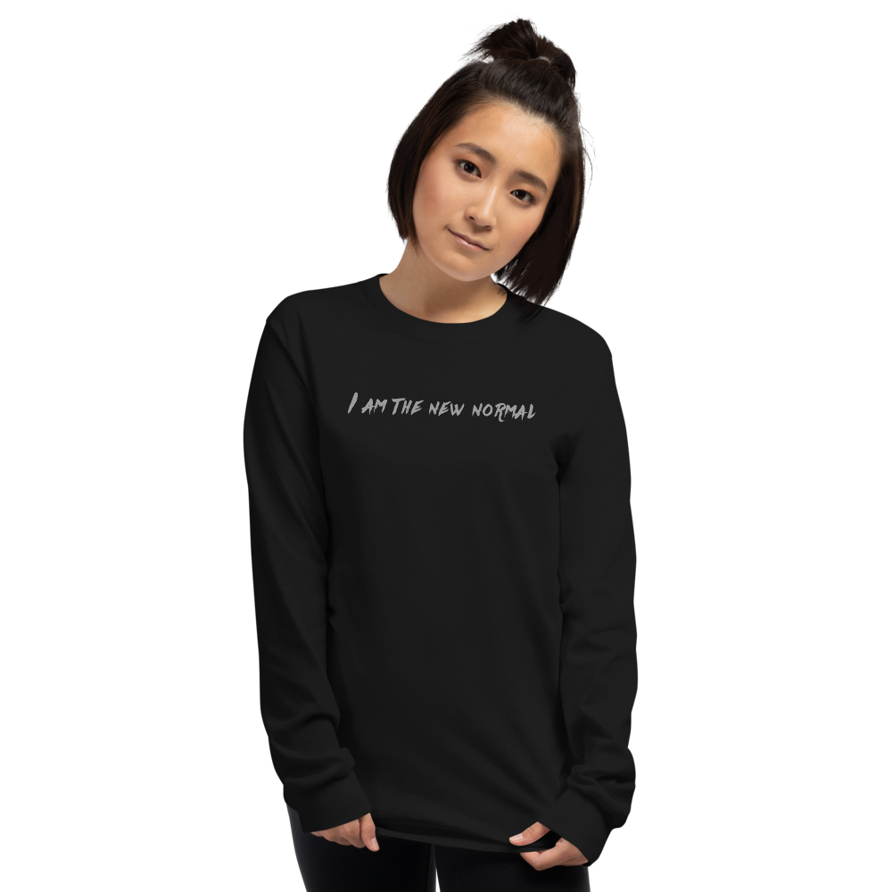"I am the new normal" printed on a black men's long sleeve shirt worn by a female