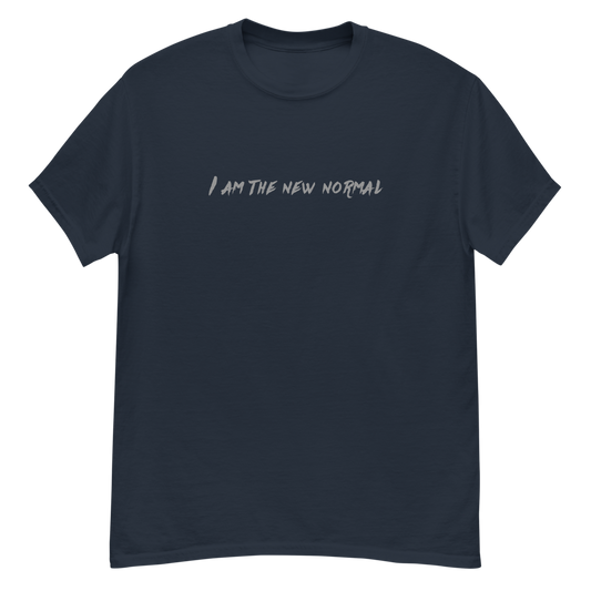 "I am the new normal" printed on a navy unisex classic tee laying on a flat surface