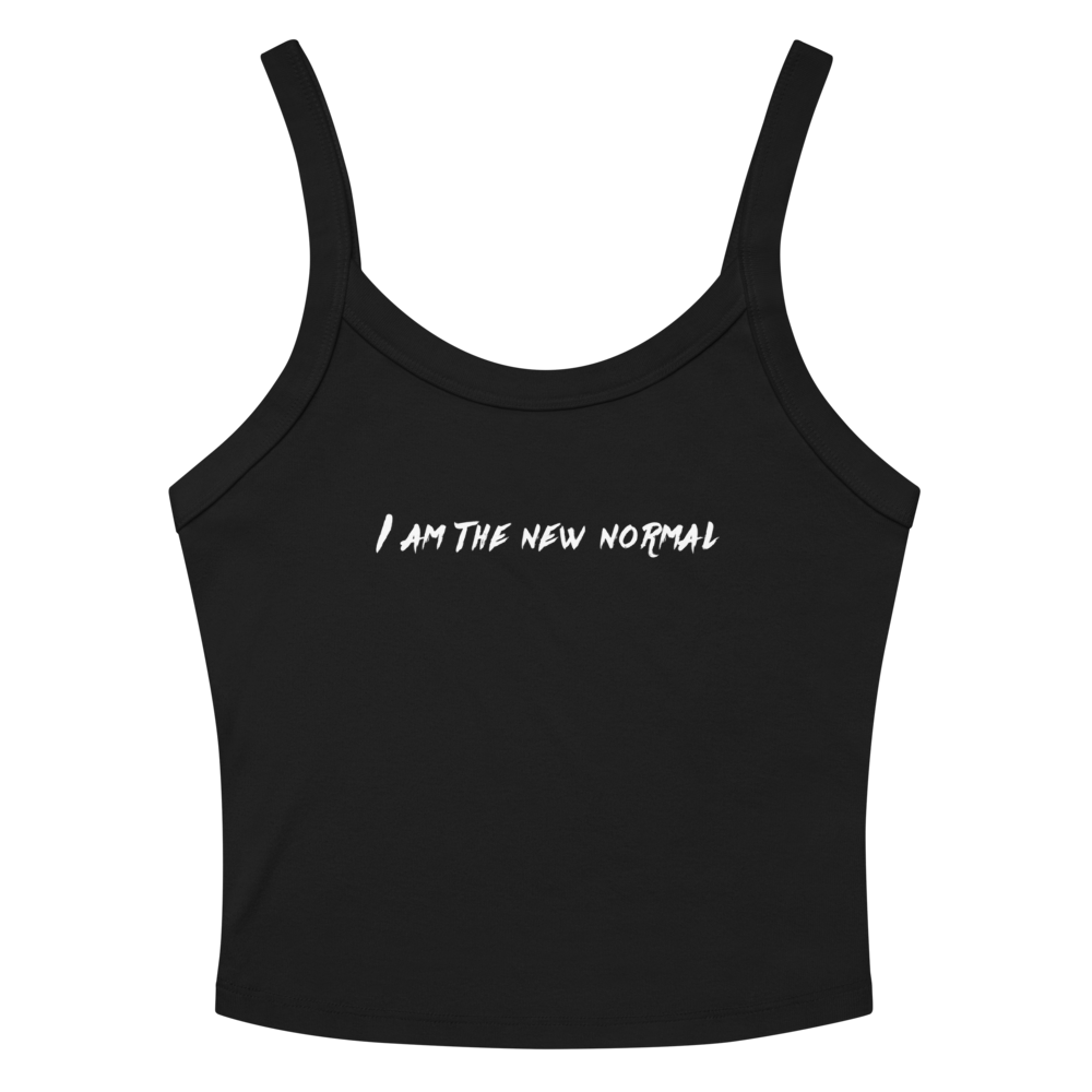 "I am the new normal" printed on a solid black blend women's micro-rib tanktop laying on a flat surface amongst sunglasses and shorts