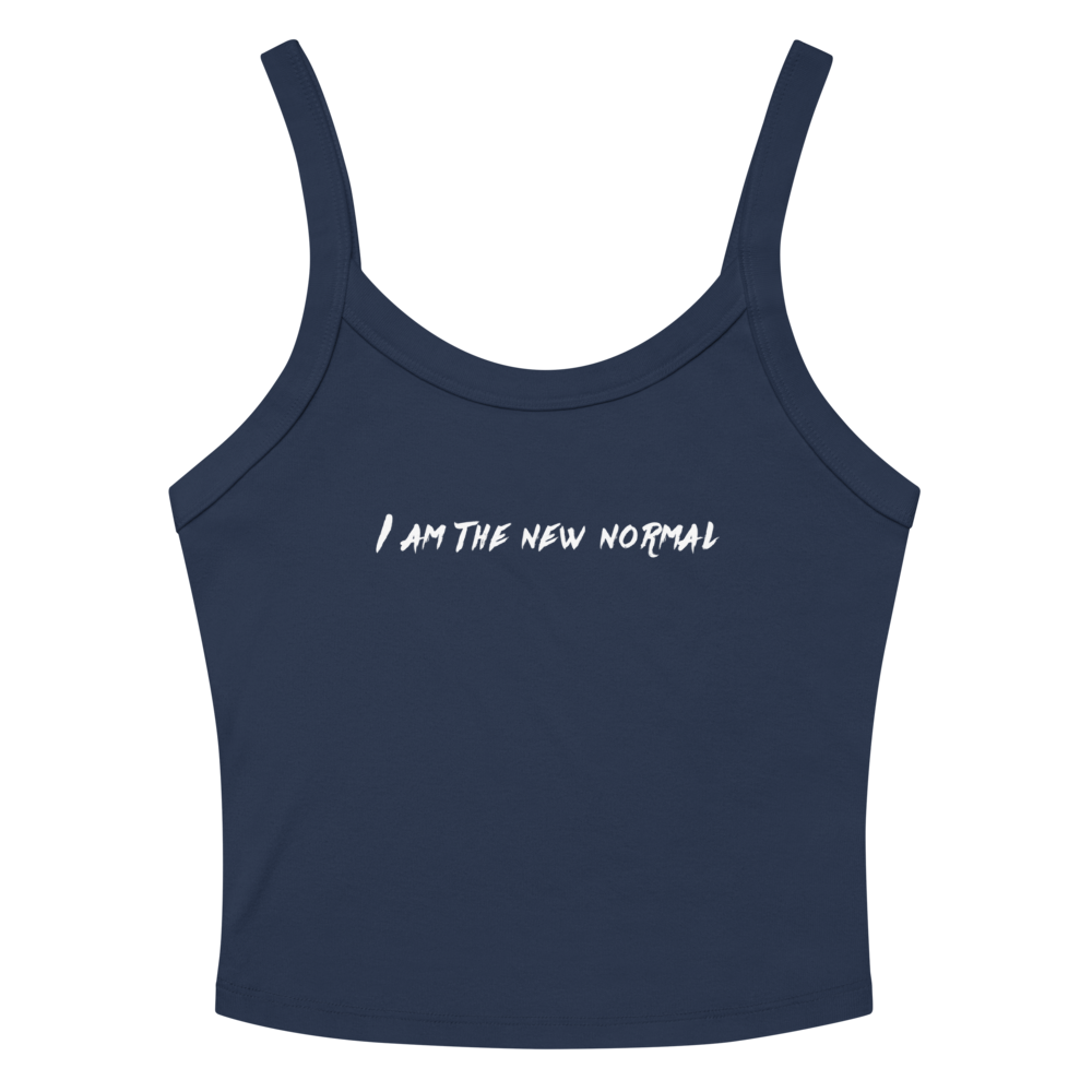 "I am the new normal" printed on a solid navy blend women's micro-rib tanktop laying on a flat surface amongst sunglasses and shorts